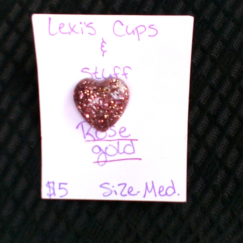 A rose gold hart pendent.